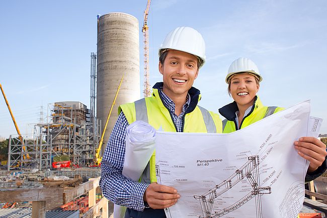 Spanish engineer looks at the construction plans