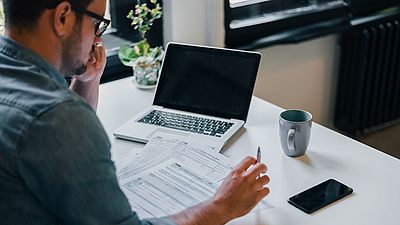 A man working on his recognition documents