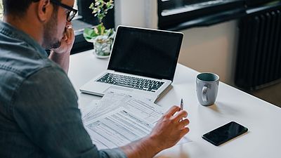 A man working on his recognition documents