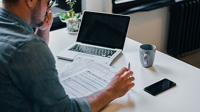 A man working on his recognition documents