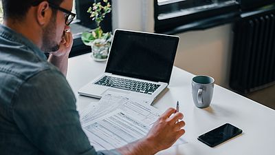 A man working on his recognition documents