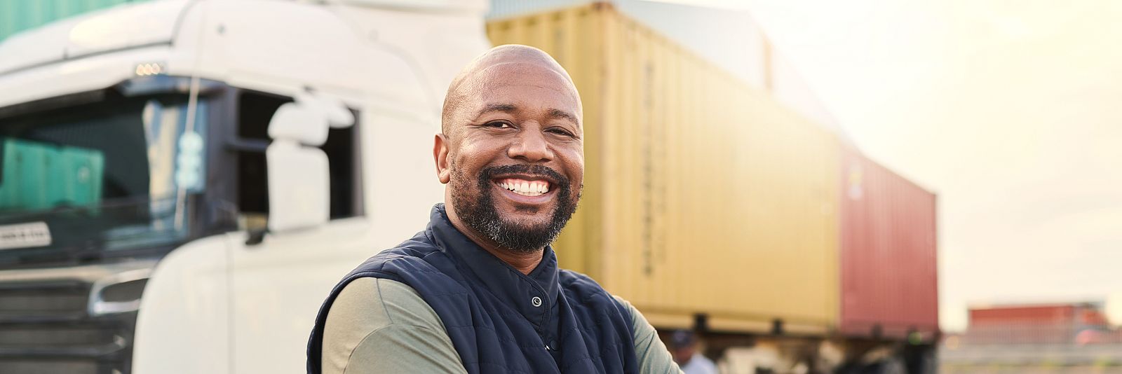 Professional driver in front of truck