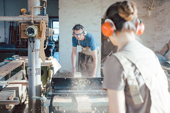 Man and woman at a workbench