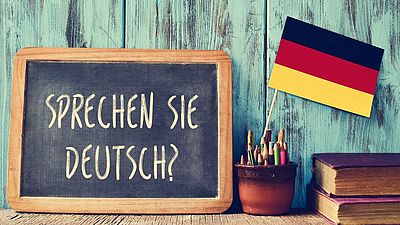 German flag next to chalk board