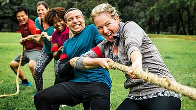 Group of international people playing in a park