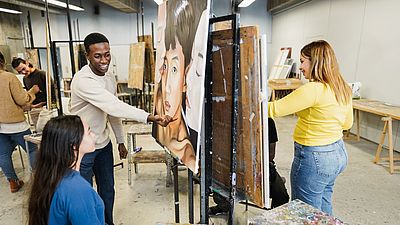 Multicultural group painting art pieces