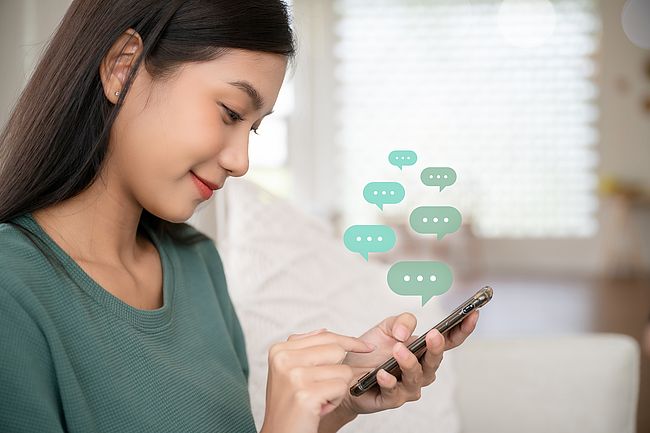 Woman chats on her mobile