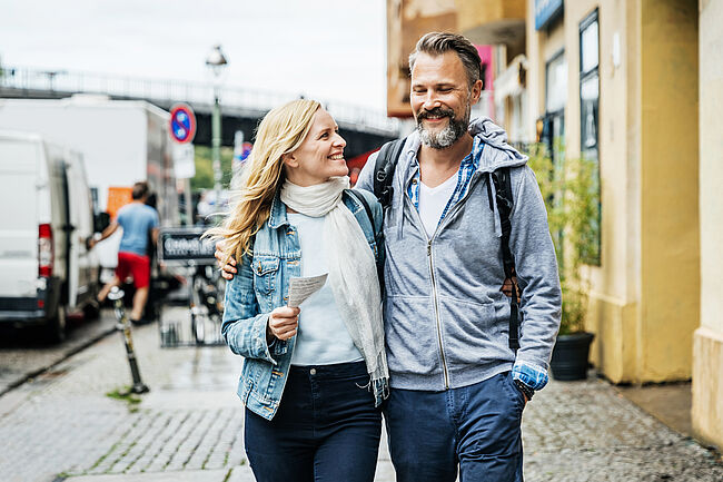Happy couple walking in a city in Germany