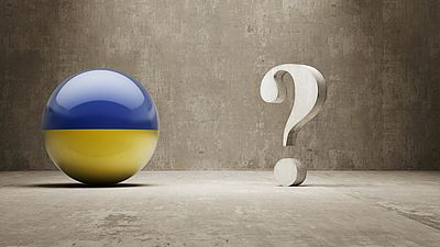 Sphere with the Ukrainian flag next to a question mark
