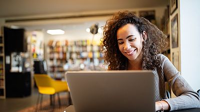 Young woman works at her studies recognition proces