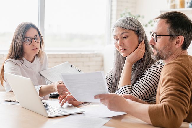 A group of international people checking documents