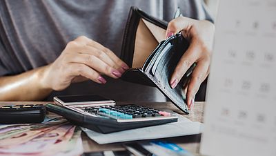 Woman counting her salary