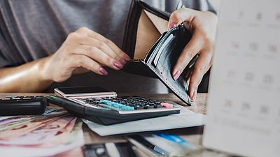 Woman counting her salary