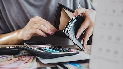 Woman counting her salary