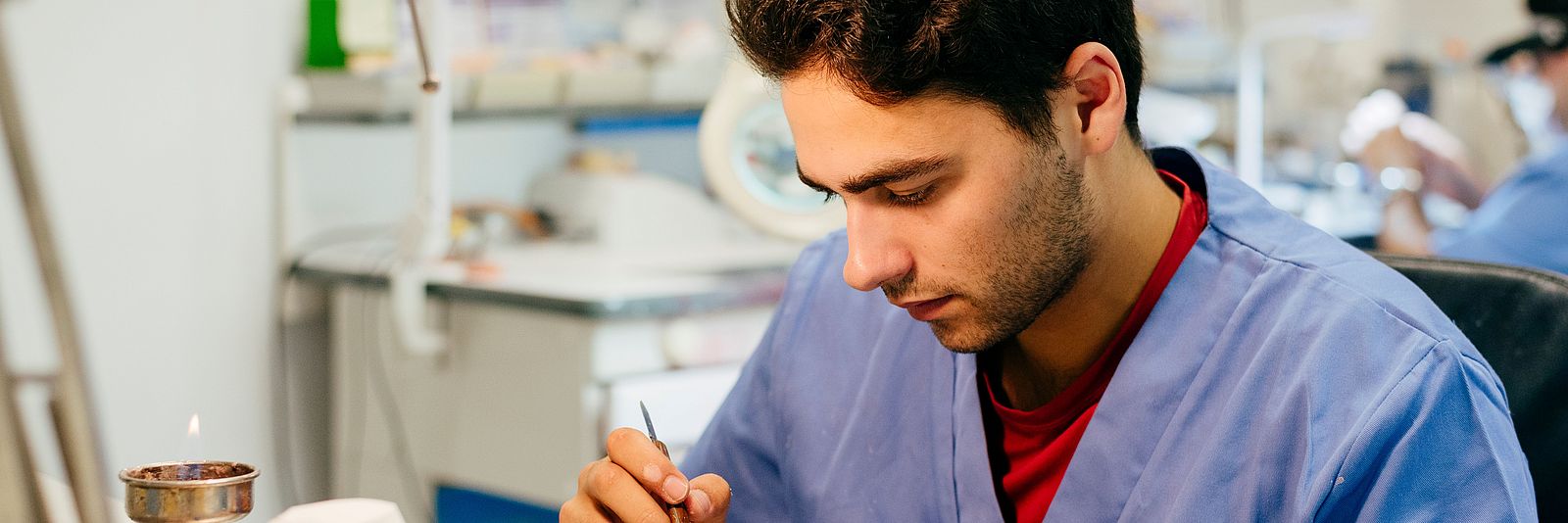 Dental technician works in the lab