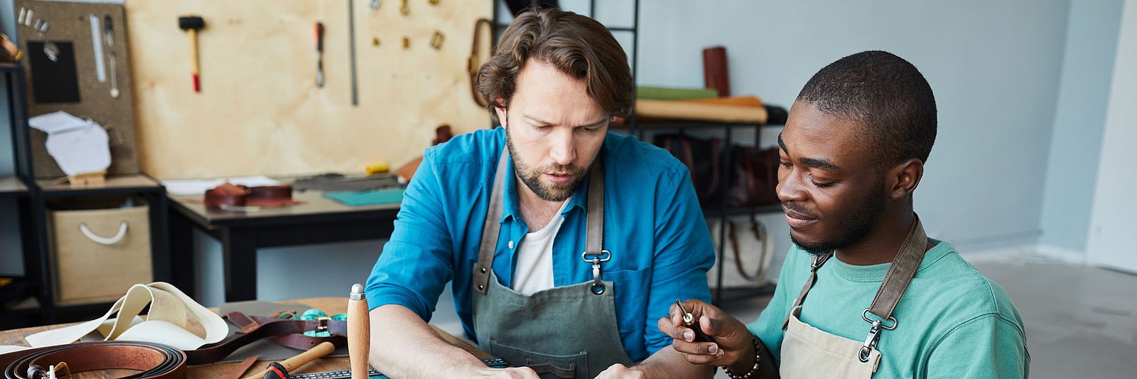Two international men working in a workshop